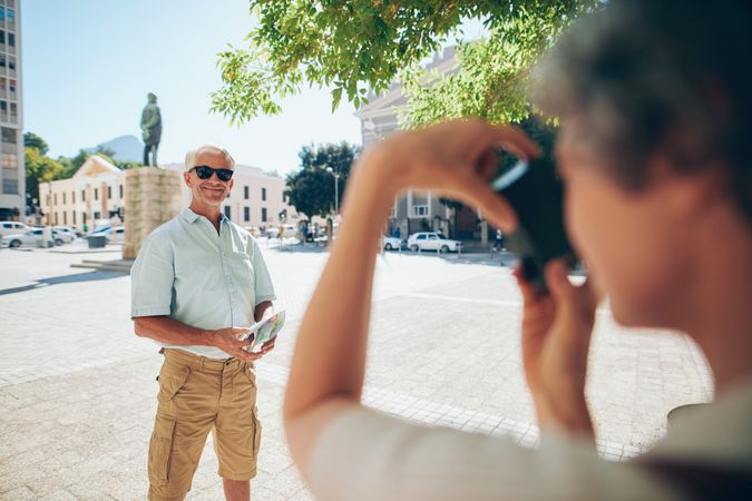 Older man posing for photograph