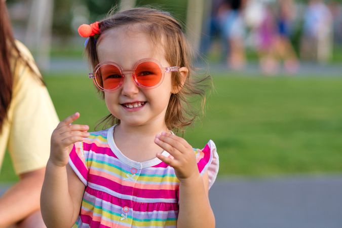 Smiling toddler enjoying summer outdoors