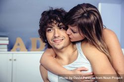 Beautiful woman kissing and embracing smiling man 4OdnZR