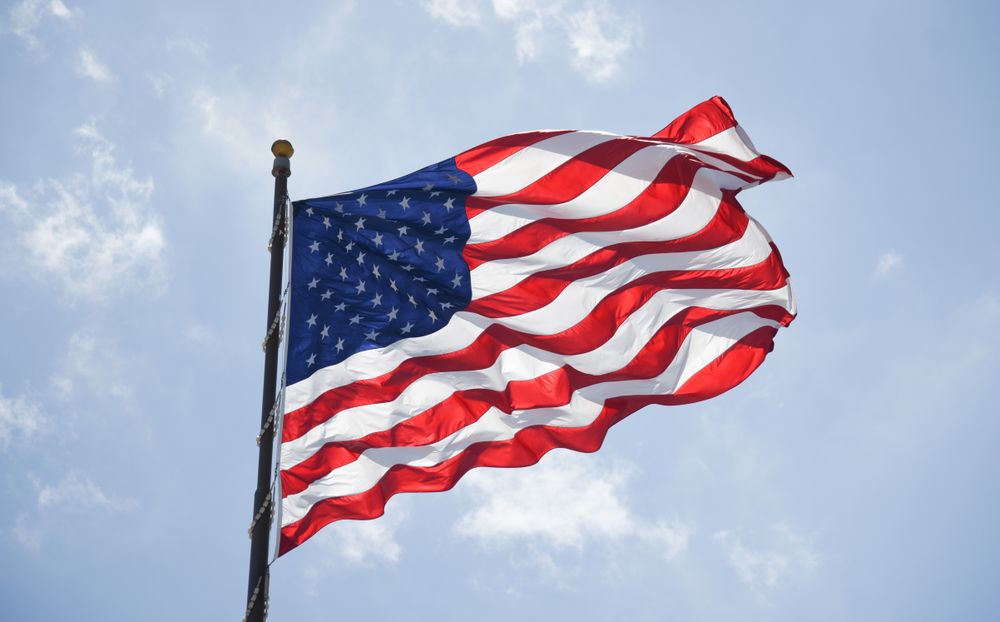 a United States Flag waving in the wind