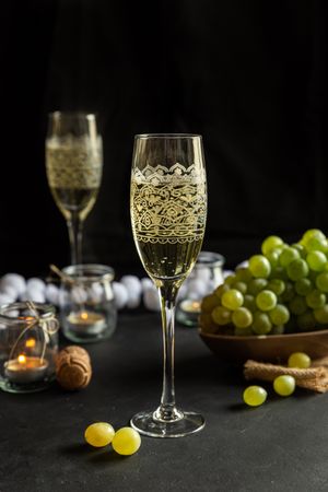 Glasses with wine and grapes