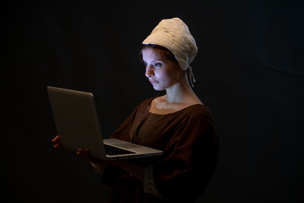 Medieval maid with laptop