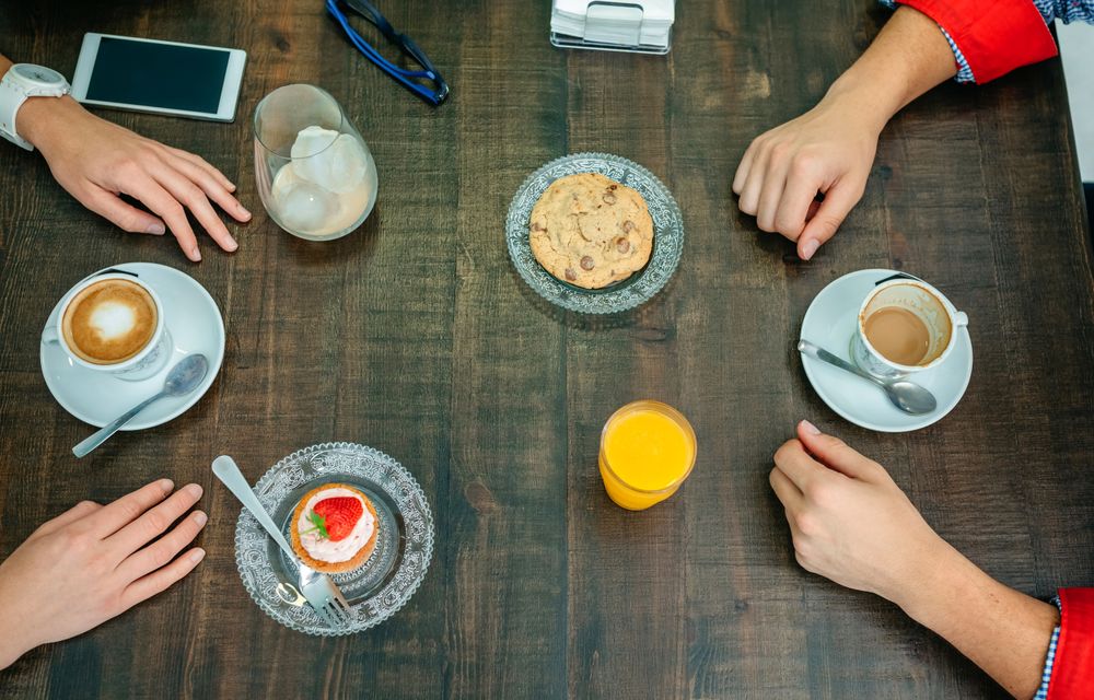 Breakfast with couple hands