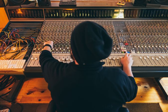 Man in a equalizer instrument in a studio