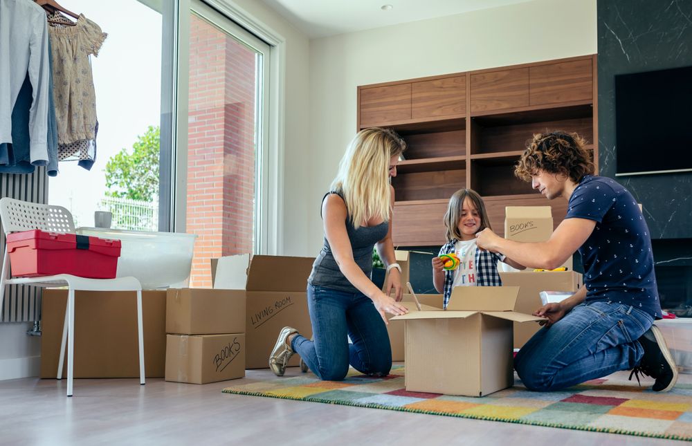 Family preparing moving toy box