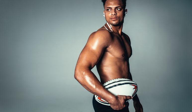 Black male model with rugby ball
