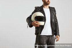 Man in dark leather jacket with light t-shirt holding motorcycle helmet 0ymeW0