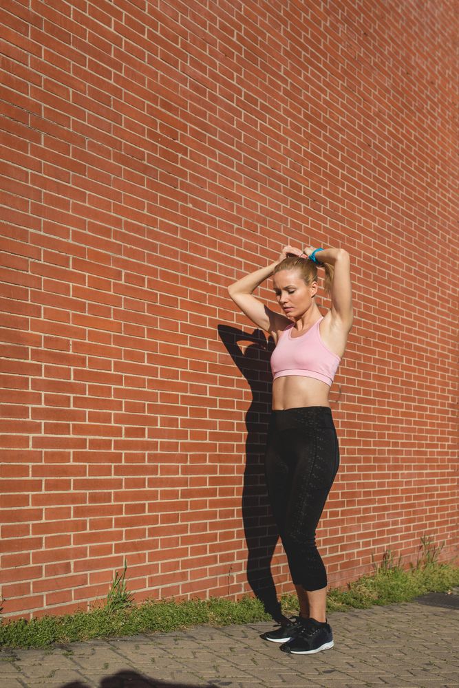 A woman is preparing to go jogging