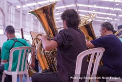 Group of people playing tuba 4AX8q5