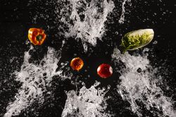 Flying fresh vegetables in splashes of water
