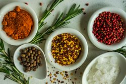 Close up of spices in bowls on kitchen counter