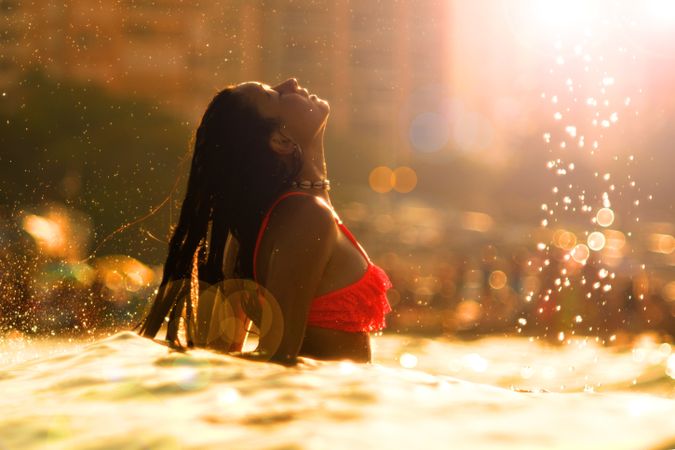 Woman shaking hair in water