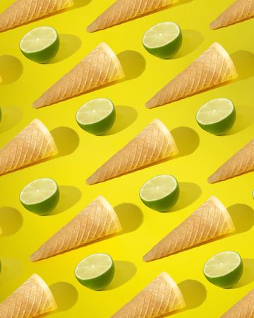 Rows of ice cream cone and halved lime