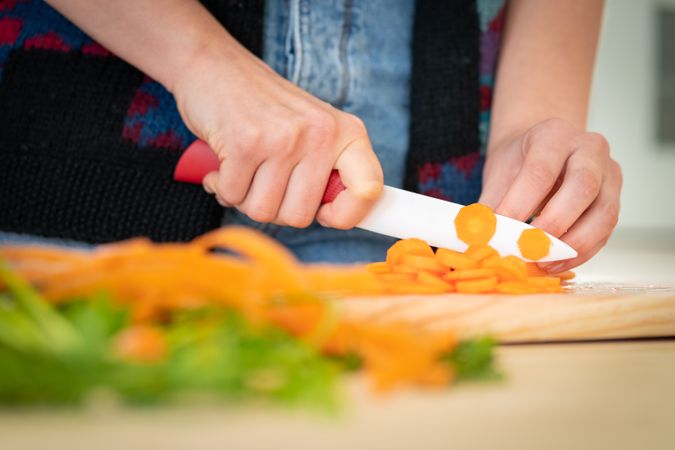 Woman preparing vegetable salad
