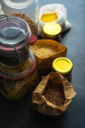 Variety of dried legumes and pasta from pantry with copy space