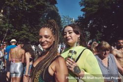 London, England, United Kingdom - August 25th, 2019: Two women with glitter at a street festival 4327O5