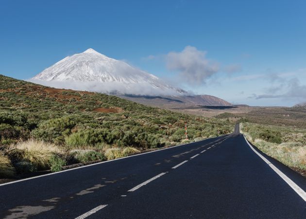 Countryside road near snowy mountain peak