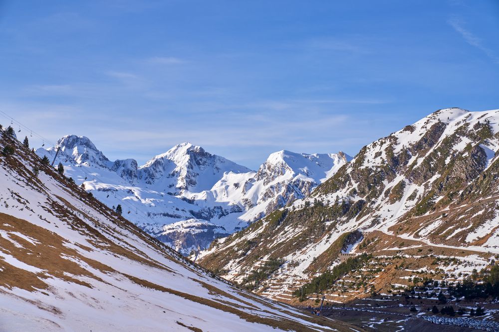 Snowy mountains against blue sky