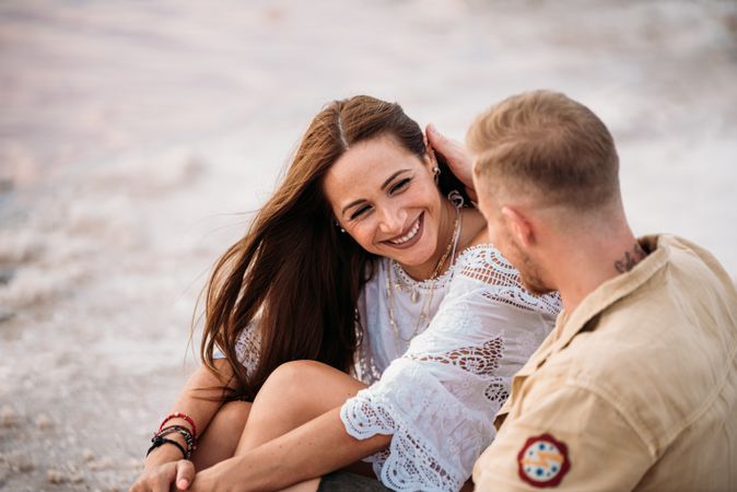 adorable couple on an amazing beach with pink water