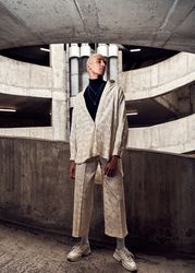 Young man standing tall in a cement structure