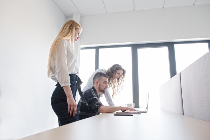 Group of colleagues working in contemporary office
