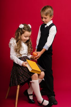 Schoolchildren in uniform with book