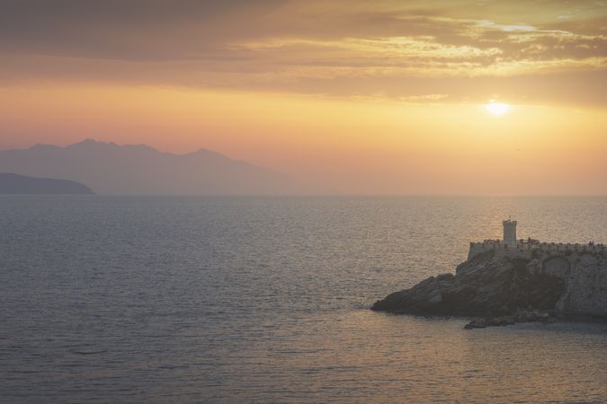 Piombino, view of Piazza Bovio and the lighthouse at sunset, Livorno, Italy