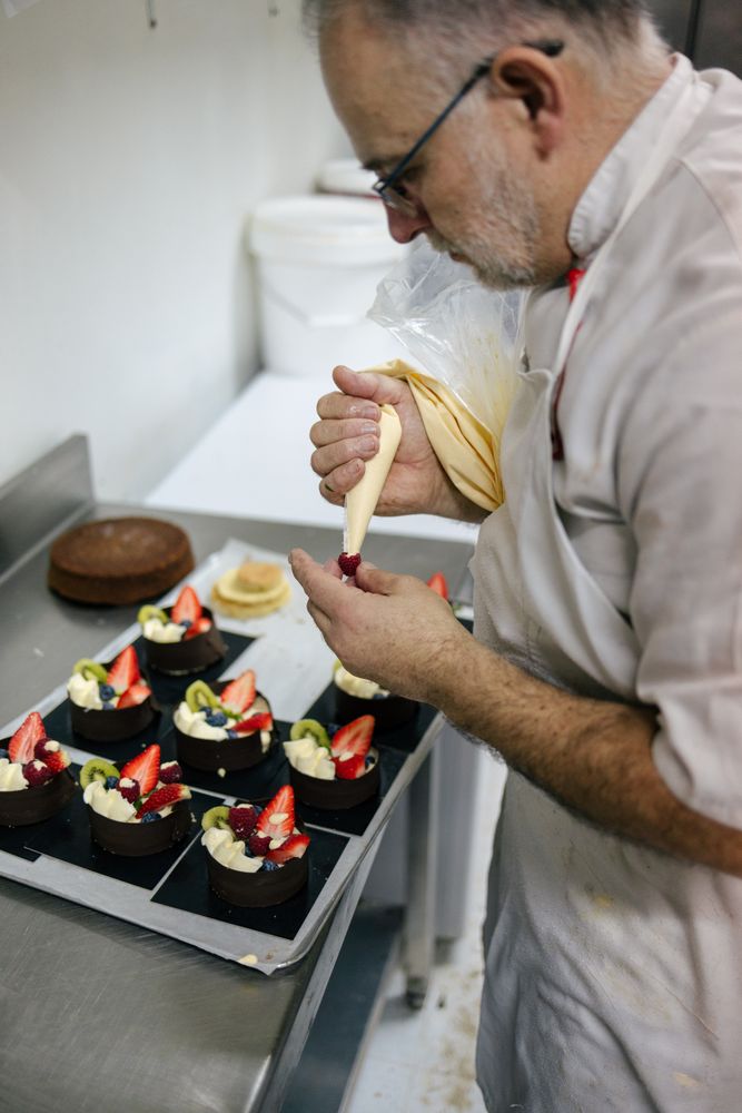 Pastry chef using a pastry bag