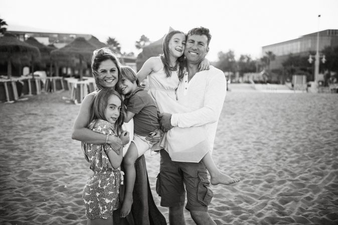 Beautiful happy family with children on beach