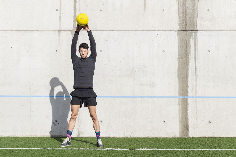 Man training with ball near wall