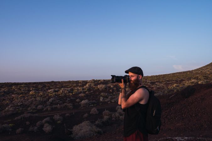 Photographer in desert landscape
