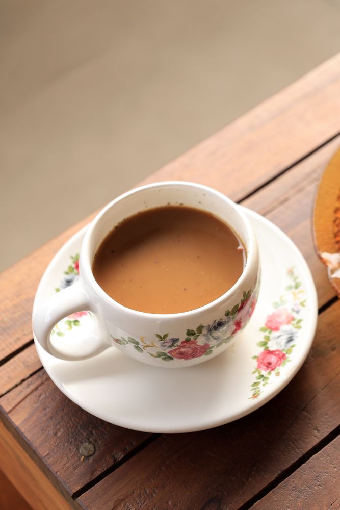 Morning Coffee with Flower Cup, Indonesian traditional Coffee with Gula Aren or Palm Sugar.