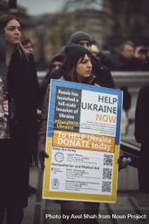 London, England, United Kingdom - March 5 2022: Woman with “help Ukraine now sign" 0Pyga5