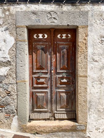 Patmian brown door with padlock