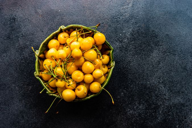 Bowl of yellow cherries