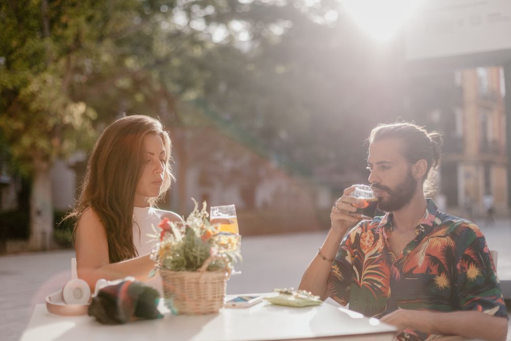Loving couple clinking glasses on cafe terrace