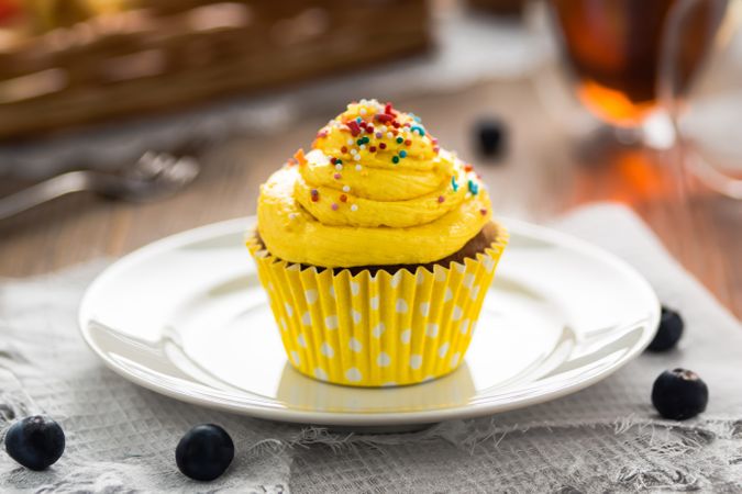 Yellow Pastry with Sprinkles on Plate