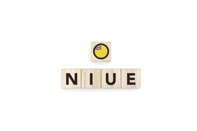 Wooden blocks bearing the name and flag of Niue.