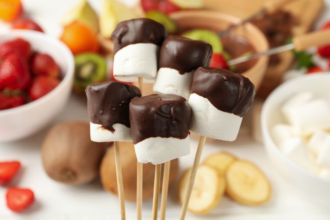 Marshmallow in chocolate, close up. Delicious sweet food