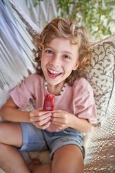 Excited kid eating yummy ice cream
