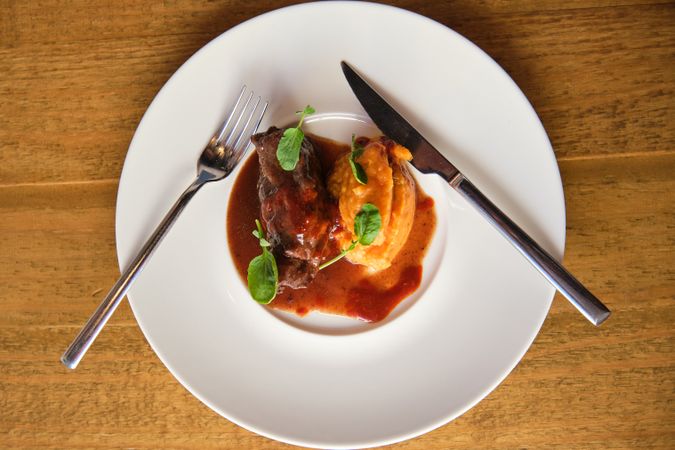 Aerial photo of a dish of veal cheeks with coconut mojo and tuna
