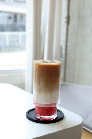 Glass of Iced Coffee Latte with Strawberry Jam