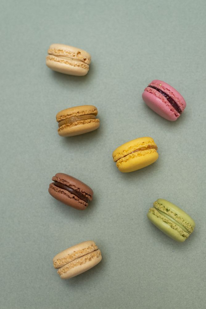 Above view of scattered macaroons on a kitchen counter