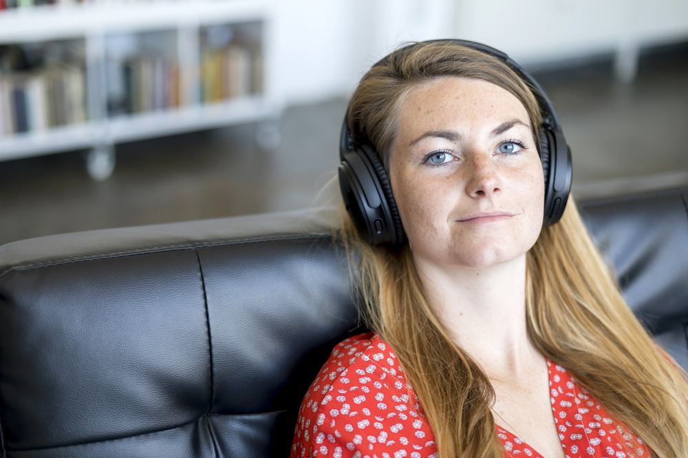 Woman listening to music on wireless headphones