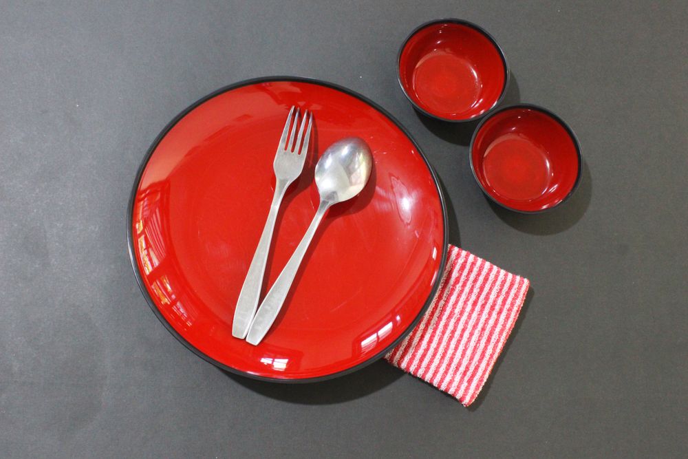 Table setting with red plates
