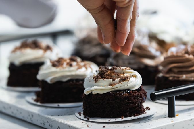 Crop baker preparing vegan dessert in kitchen