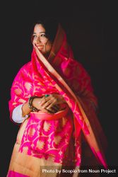 Woman wearing pink and brown Sari 5qoQpb