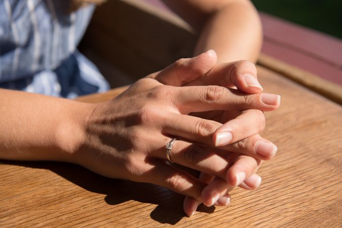 Crop female hands with engagement ring