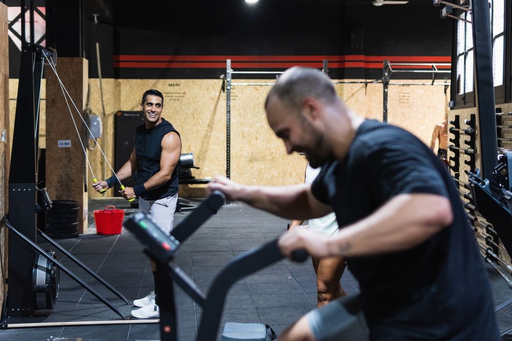 Hispanic sportspeople training in gym