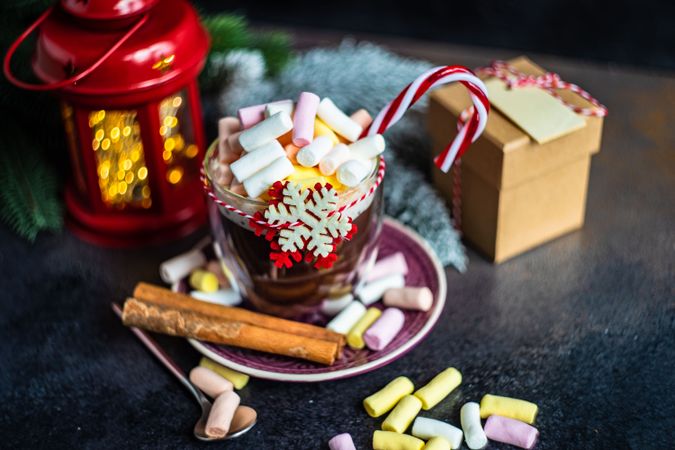 Marshmallow hot chocolate on table with red lantern and gift